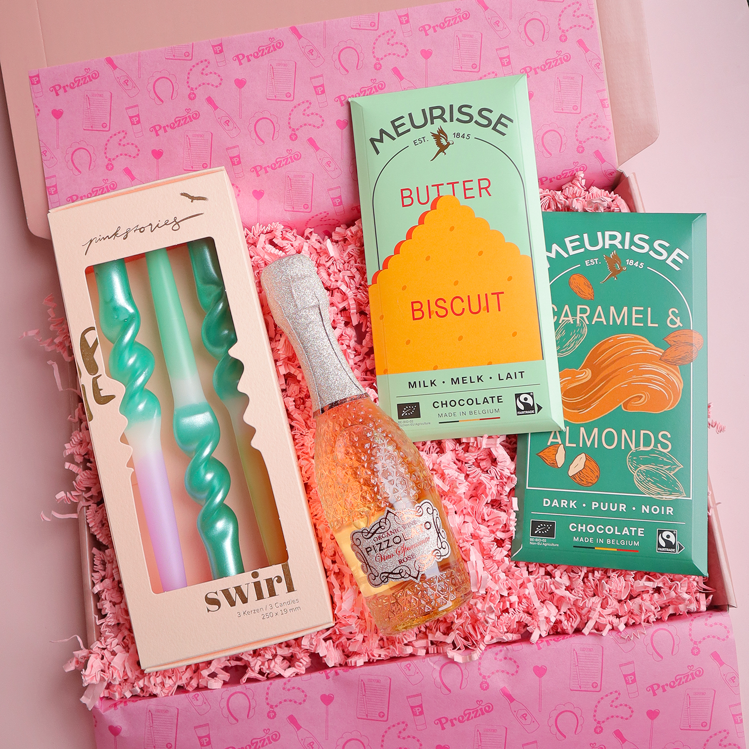 Feestelijke cadeaubox met rosé, luxe chocolade en design kaarsen